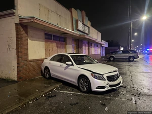 Man Charged After Two Men Shot In Crashed BMW